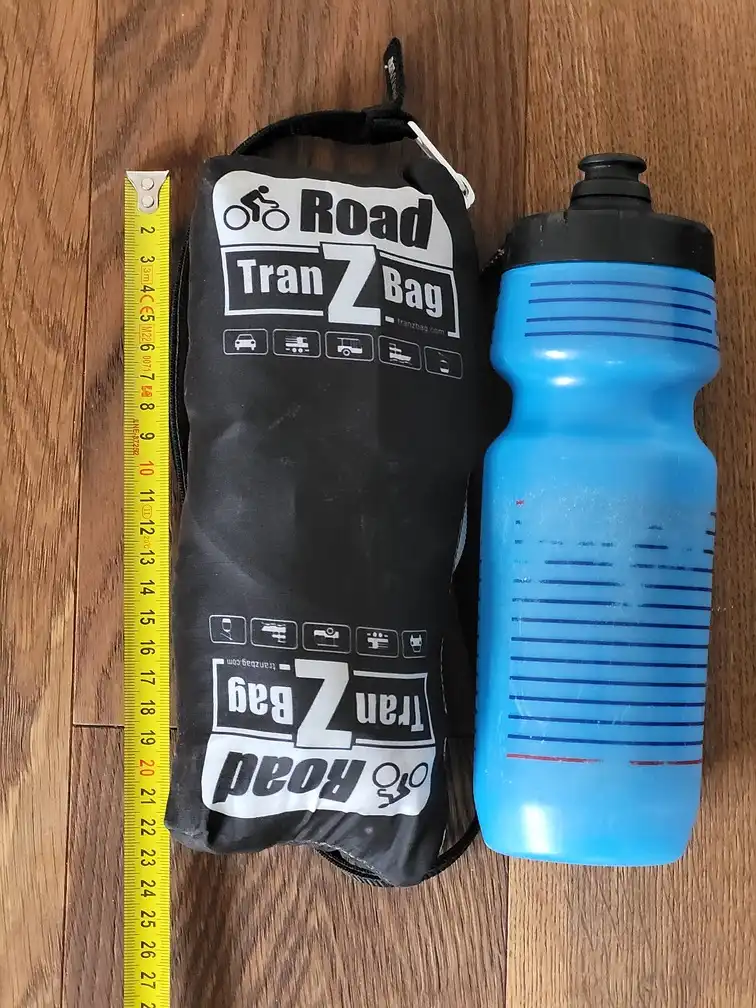 Folded bag next to a bottle