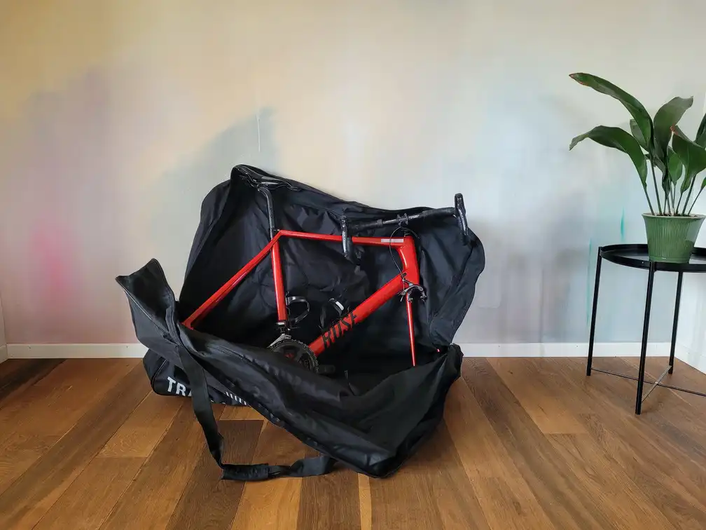 Bicycle frame in a bag with 2 wheels removed