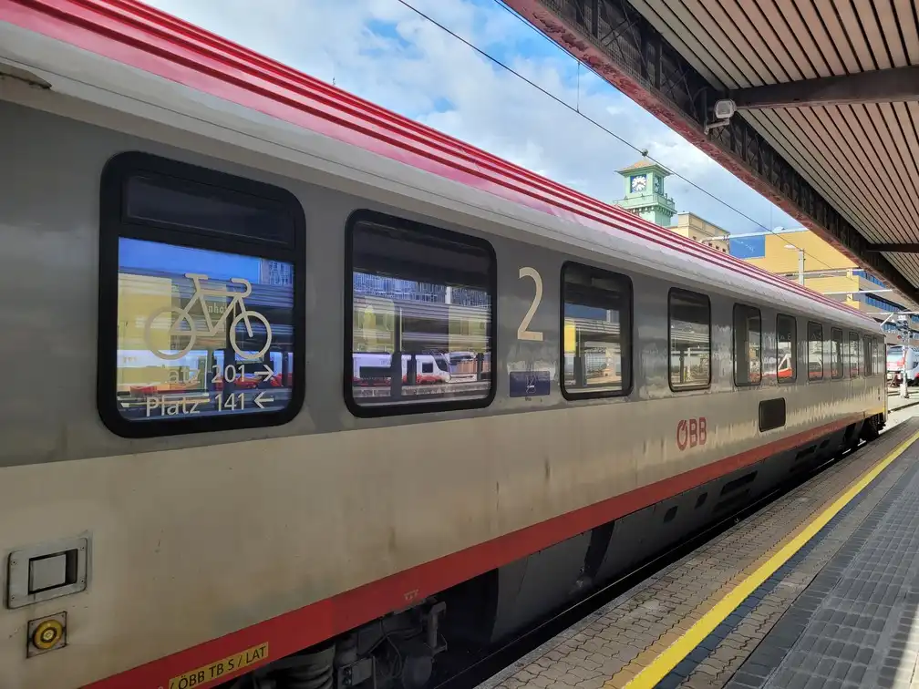 Traditional carriage on a platform with a bicycle logo