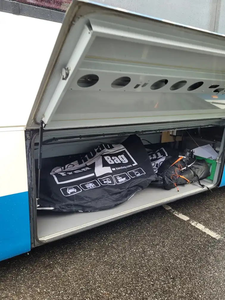 Storage space with packed bicycles under a replacement bus