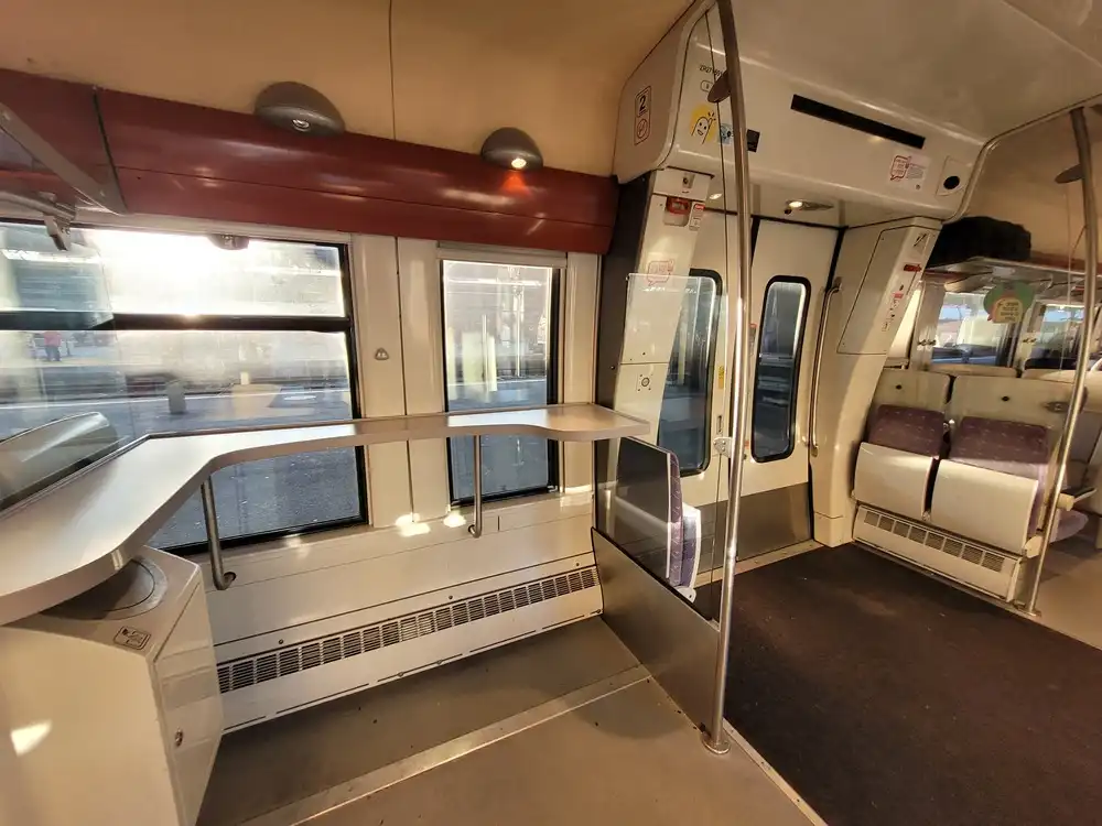 Space with a bar table next to some of the doors