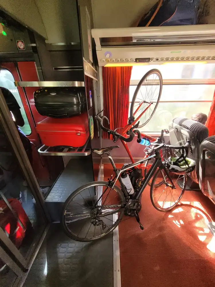 Bicycles playing acrobatics behind first class seats