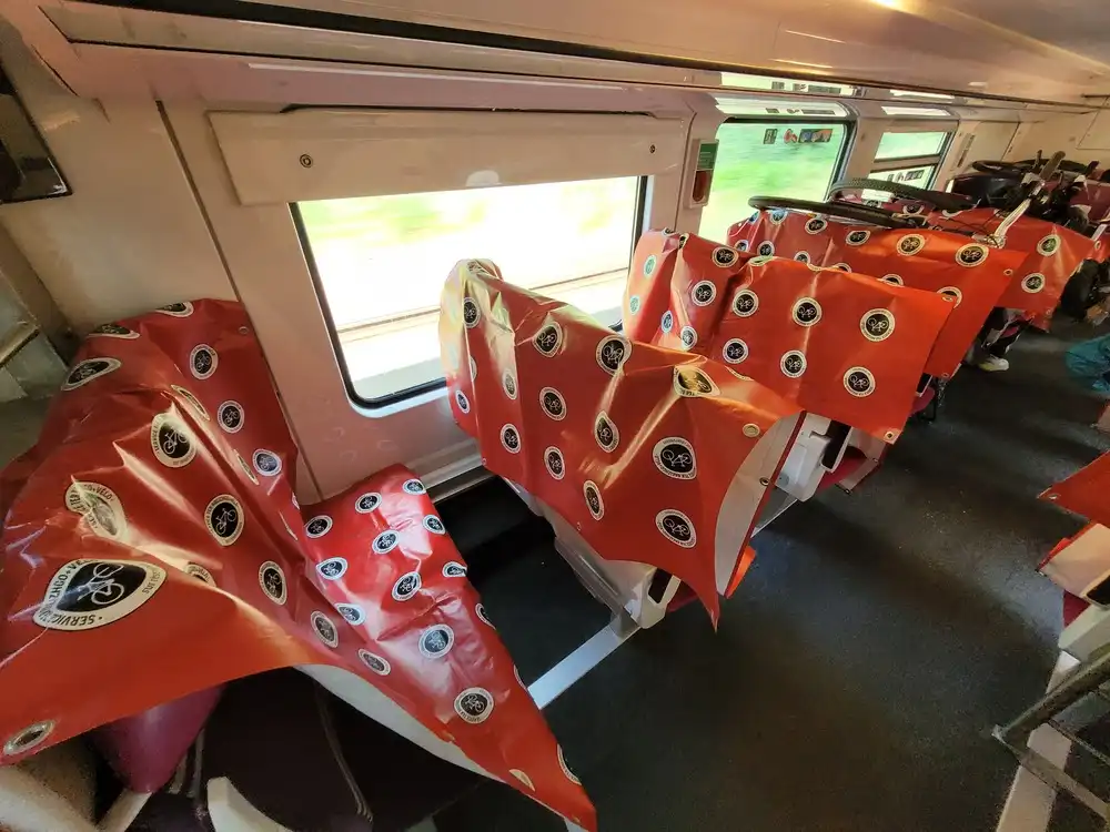 Room with seats covered with a plastic protection to put bicycles on them