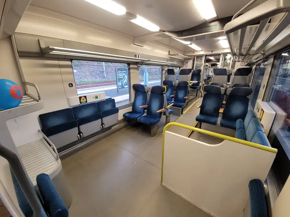 Multi-use space with foldable seats along the sides