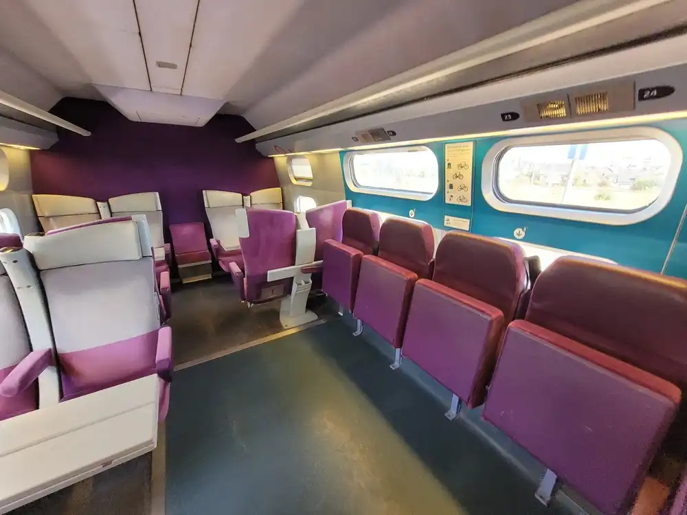 Bicycle space with foldable seats along the side