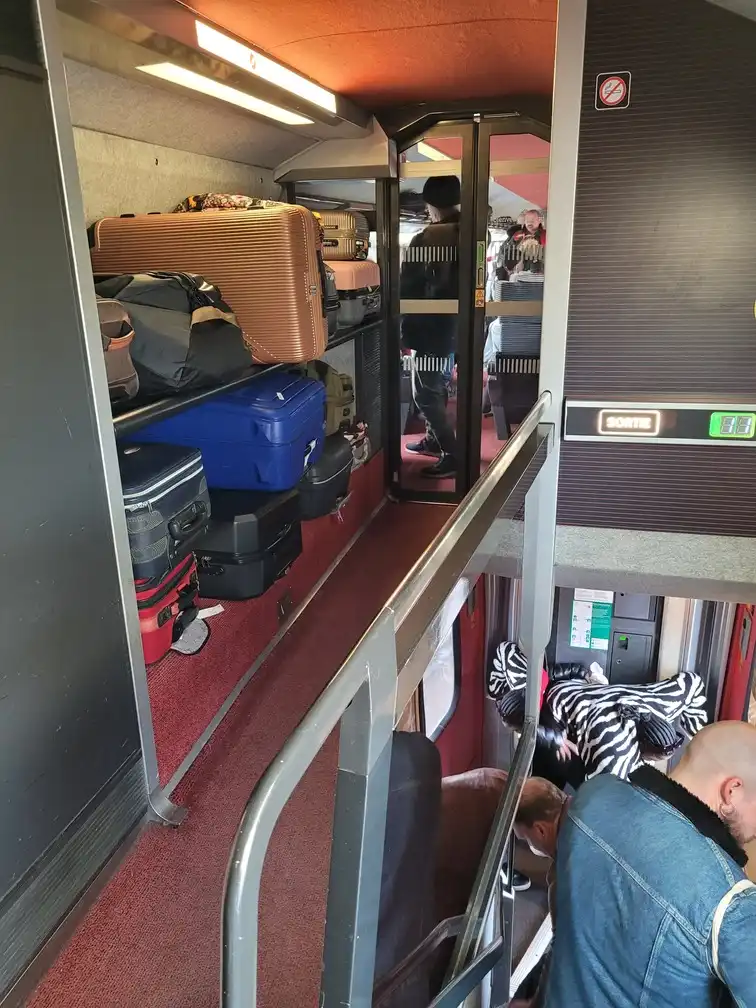 Luggage rack upstairs in front of the staircase