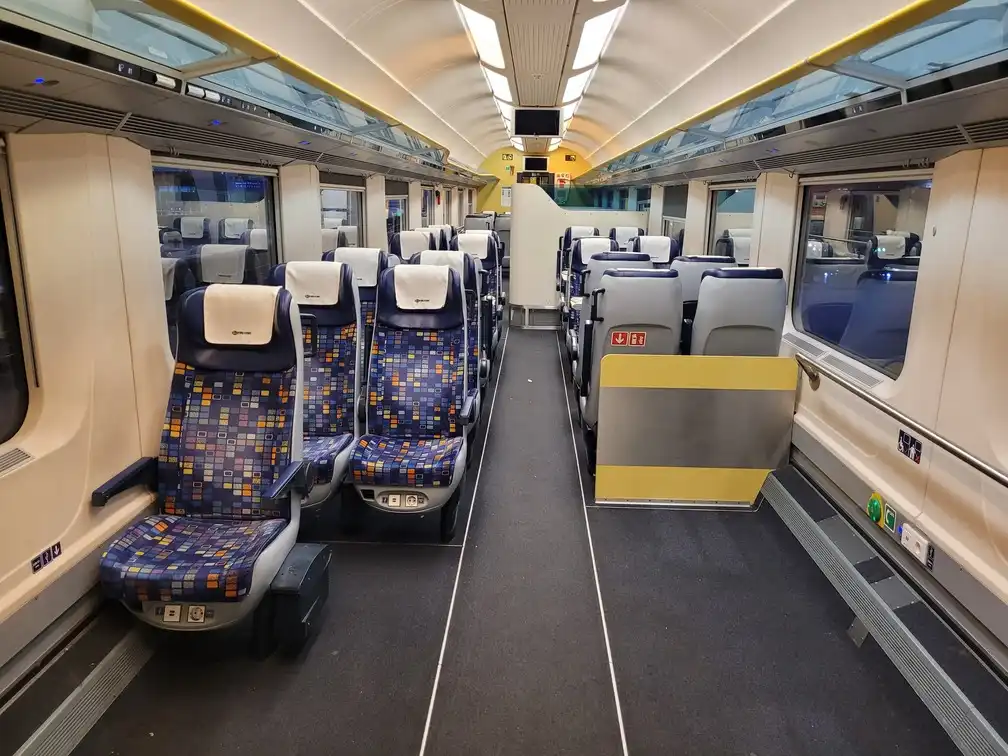 Interior of a mixed-use carriage with wheelchair space and family area