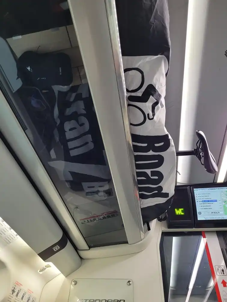 Packed bicycle in the overhead rack in an ETR 500 train