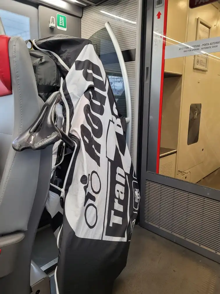 Packed bicycle next to a luggage rack in an ETR 700 train