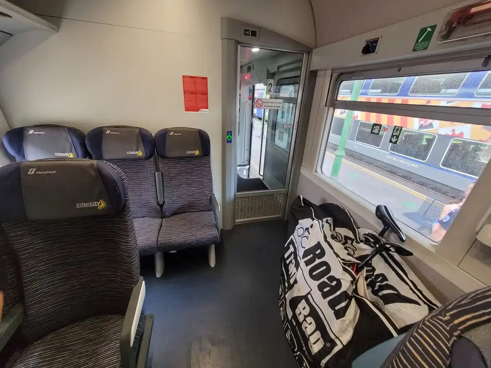 Packed bicycles next to the last seats in a second class carriage