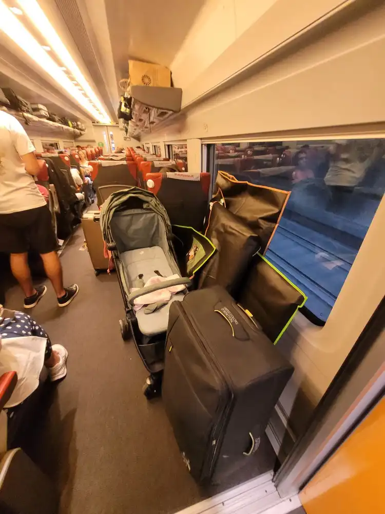 Wheelchair space full of luggage in an AGV train