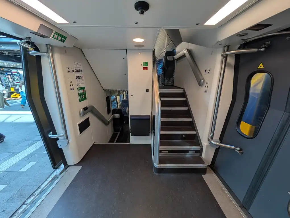 Entrance and stairs in a VIRM train