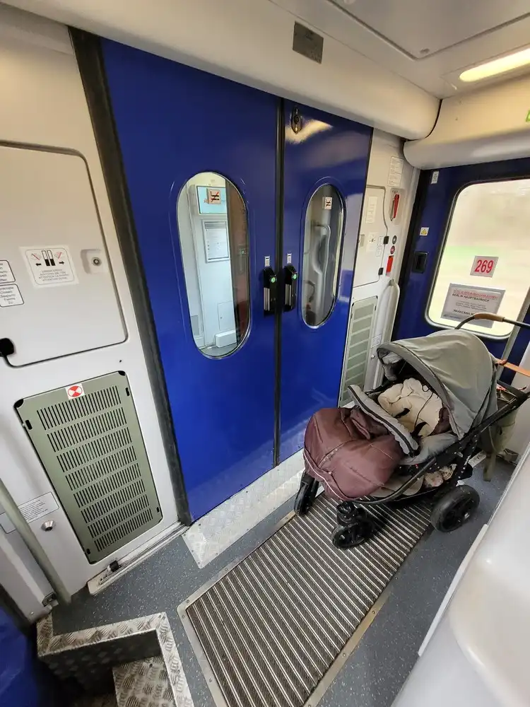Entrance area with a stroller in an intercity train