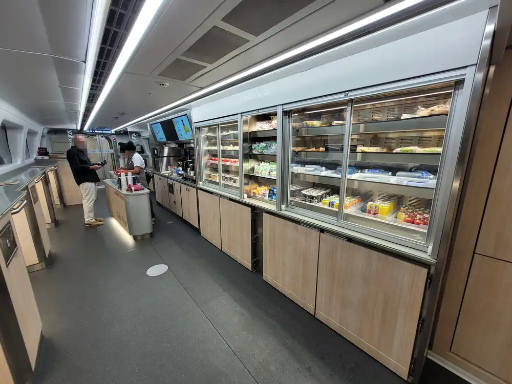 Bar area with self-service food shelves in a Renfe series 106