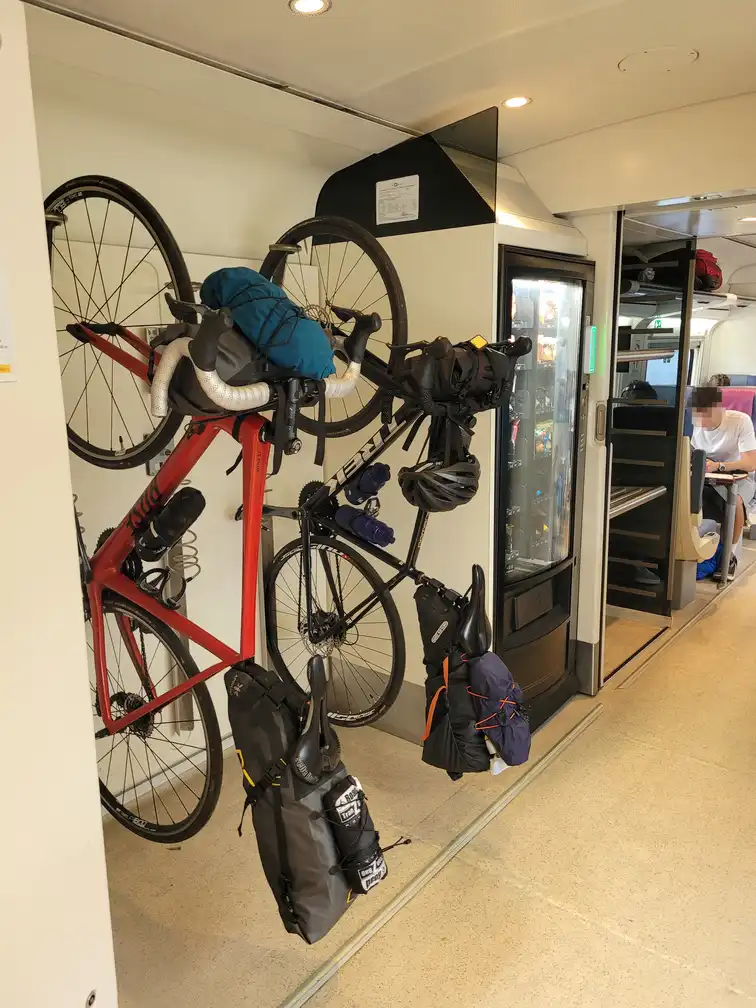 Bicycle space with 3 vertical hooks in a Renfe series 121