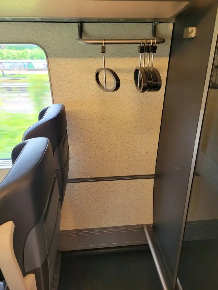 Coat hangers in the first-class section of an Øresundståg train