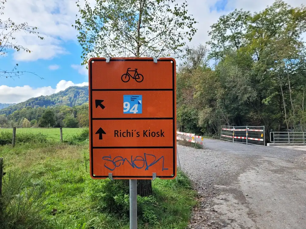 Orange diversion sign for a cycling route