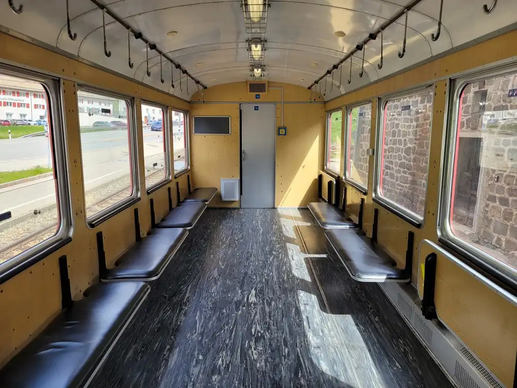 Wagon with foldable benches along the windows and hooks for bicycles on the ceiling