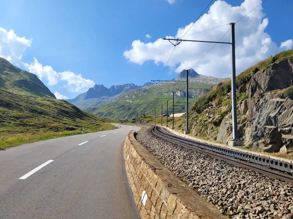 Mountain road along a railway